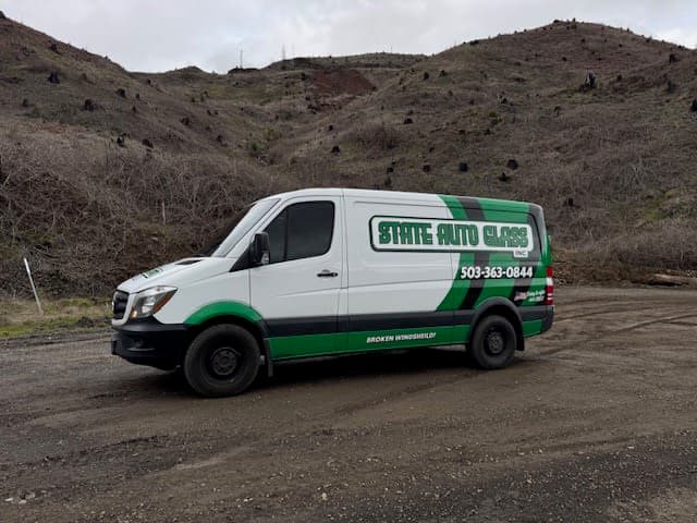 State Auto Glass branded mobile service van parked in the hills near Salem, Oregon