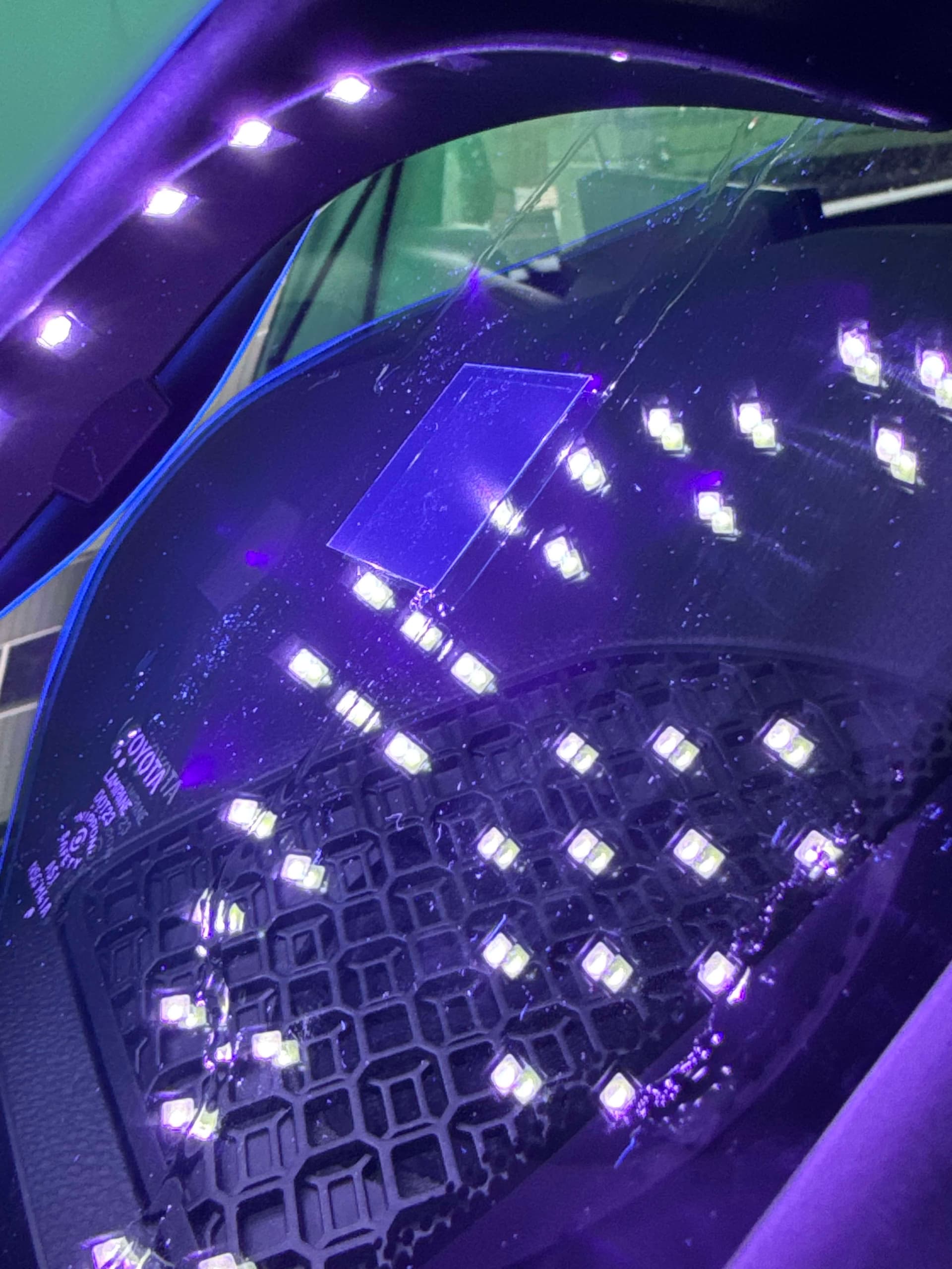 Rock chip resin repair with UV curing, close-up