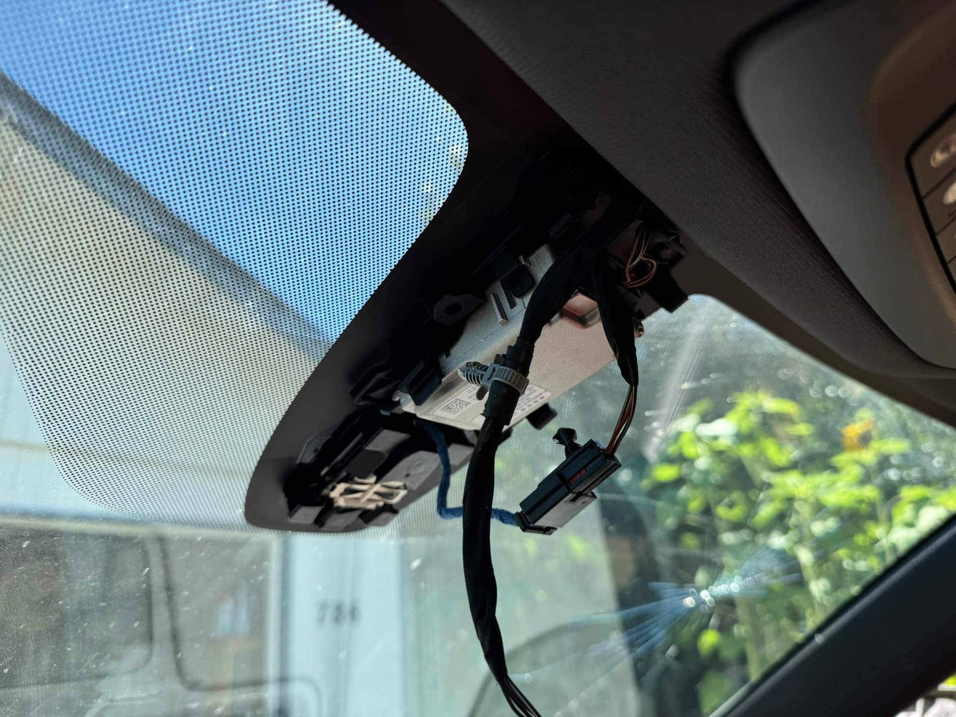 inside view, rear view mirror and camera ready for disassembly